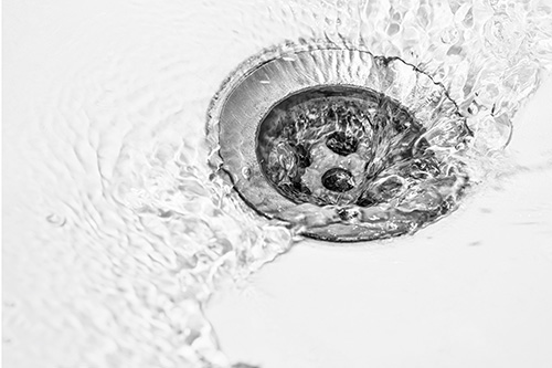 water running down sink drain